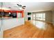 Open-concept living room featuring hardwood floors, fireplace, and seamless flow to the kitchen at 485 Sherman Way, Decatur, GA 30033
