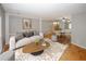 Open living room with modern decor, dining area, and hardwood floors throughout at 485 Sherman Way, Decatur, GA 30033