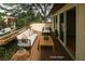 Cozy patio with stylish outdoor furniture, wood decking, and verdant garden view at 485 Sherman Way, Decatur, GA 30033