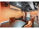 Finished basement with a bar, comfortable seating, and visible ductwork at 5826 Sarazen Trl, Douglasville, GA 30135