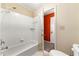 Clean bathroom with white tile shower-tub combo and a toilet, providing essential amenities at 5826 Sarazen Trl, Douglasville, GA 30135