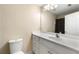 Bright bathroom features white cabinets, large mirror, and ample space at 5826 Sarazen Trl, Douglasville, GA 30135