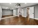 Bedroom with a mirrored wall, hardwood floors, and neutral gray paint at 5826 Sarazen Trl, Douglasville, GA 30135