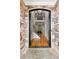 Grand foyer entrance with stone accents, soaring ceilings, and hardwood floors leads to second floor at 5826 Sarazen Trl, Douglasville, GA 30135