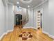 Inviting foyer featuring hardwood floors with decorative medallion, a staircase, and clerestory windows at 5826 Sarazen Trl, Douglasville, GA 30135