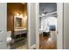 View of the main bedroom featuring hardwood floors with connected bathroom at 5826 Sarazen Trl, Douglasville, GA 30135