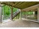 Outdoor patio with brick pavers, stairs to deck, and screened porch at 5826 Sarazen Trl, Douglasville, GA 30135