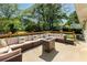 Outdoor back deck with ample seating, a fire pit, and relaxing backyard views at 1042 Oakdale Se Dr, Smyrna, GA 30080