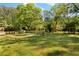 Expansive backyard with lush green grass and mature trees, perfect for outdoor activities at 1042 Oakdale Se Dr, Smyrna, GA 30080