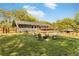 Spacious backyard with a well-maintained lawn, wooden deck, and a cozy fire pit surrounded by seating at 1042 Oakdale Se Dr, Smyrna, GA 30080