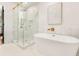 This sleek bathroom boasts a luxurious soaking tub and separate glass-enclosed shower at 1042 Oakdale Se Dr, Smyrna, GA 30080