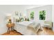 This cozy bedroom features bright windows, hardwood floors, and stylish decor at 1042 Oakdale Se Dr, Smyrna, GA 30080