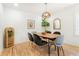 Bright dining room featuring hardwood floors, stylish lighting, and modern decor for an inviting atmosphere at 1042 Oakdale Se Dr, Smyrna, GA 30080