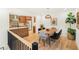 Inviting dining area adjacent to the kitchen, featuring hardwood floors and stylish modern decor at 1042 Oakdale Se Dr, Smyrna, GA 30080