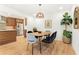 Inviting dining area featuring modern furniture, ample lighting, and stylish decor at 1042 Oakdale Se Dr, Smyrna, GA 30080