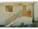 Inviting front entrance with freshly painted stairs, wood railings, and well-maintained landscaping at 1042 Oakdale Se Dr, Smyrna, GA 30080