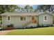 Inviting home exterior with fresh paint, a new roof, updated landscaping, and a charming front entry at 1042 Oakdale Se Dr, Smyrna, GA 30080