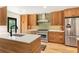 Modern kitchen with custom cabinets, stainless steel appliances, and a large center island at 1042 Oakdale Se Dr, Smyrna, GA 30080
