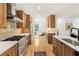 Modern kitchen featuring stainless steel appliances, sleek countertops, and ample cabinet space at 1042 Oakdale Se Dr, Smyrna, GA 30080