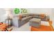 Spacious living room with sectional couch and ottoman at 1042 Oakdale Se Dr, Smyrna, GA 30080