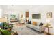 Spacious living room with hardwood floors and stylish decor, perfect for relaxing and entertaining guests at 1042 Oakdale Se Dr, Smyrna, GA 30080