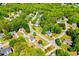 An aerial view shows a well-maintained community with mature trees and neatly kept lawns at 210 Creekside Overlook, Hiram, GA 30141