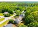 An aerial perspective showcases homes nestled among lush greenery and well-manicured lawns at 210 Creekside Overlook, Hiram, GA 30141