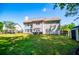 Spacious, well-maintained backyard with a patio and outdoor dining set perfect for entertaining and relaxation at 210 Creekside Overlook, Hiram, GA 30141