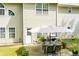 Backyard featuring outdoor seating, a grill, and a well-maintained lawn at 210 Creekside Overlook, Hiram, GA 30141