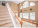 Bright foyer with staircase, high ceilings, large windows, and hardwood flooring accents at 210 Creekside Overlook, Hiram, GA 30141