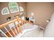 High-ceiling foyer featuring staircase, view of living room, and abundant natural light at 210 Creekside Overlook, Hiram, GA 30141