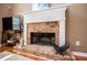 Close-up of brick fireplace with white mantel, creating a warm and inviting ambiance at 210 Creekside Overlook, Hiram, GA 30141