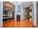 Inviting foyer featuring hardwood floors, elegant decor, and seamless flow into the dining area at 210 Creekside Overlook, Hiram, GA 30141
