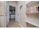 Hallway with tile floor and doorway to a laundry room at 210 Creekside Overlook, Hiram, GA 30141