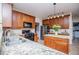 Modern kitchen with granite countertops, stainless steel appliances, and wooden cabinets at 210 Creekside Overlook, Hiram, GA 30141