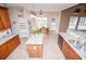Bright kitchen featuring granite countertops, wooden cabinets, and eat in dining at 210 Creekside Overlook, Hiram, GA 30141