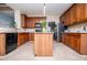 Spacious kitchen with wood cabinets, granite countertops, and stainless steel refrigerator at 210 Creekside Overlook, Hiram, GA 30141