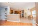 Open concept kitchen with wooden cabinets, countertops, island and connected to dinning room at 210 Creekside Overlook, Hiram, GA 30141