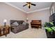Inviting living room with a cozy sofa, piano, and ample space for relaxation and entertainment at 210 Creekside Overlook, Hiram, GA 30141