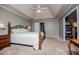 Spacious main bedroom boasts tray ceiling, neutral carpet, and ample natural light at 210 Creekside Overlook, Hiram, GA 30141