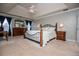 Comfortable main bedroom with king bed, ceiling fan, and an abundance of natural light at 210 Creekside Overlook, Hiram, GA 30141
