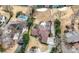 An aerial view of several houses with manicured lawns and swimming pools at 3167 Bay View Dr, Jonesboro, GA 30236