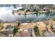 An aerial view showing lakefront property with a private dock and lush landscaping at 3167 Bay View Dr, Jonesboro, GA 30236