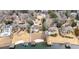 Aerial view showcasing neighborhood properties with lake access, including private boat docks at 3167 Bay View Dr, Jonesboro, GA 30236