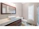 Bathroom features square white sink, marble countertop and dark cabinets at 3167 Bay View Dr, Jonesboro, GA 30236