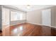 Bedroom with hardwood floors, trim, closet, windows and ceiling fan at 3167 Bay View Dr, Jonesboro, GA 30236