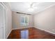Bedroom with hardwood floors, white trim, closet and window at 3167 Bay View Dr, Jonesboro, GA 30236