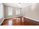 Bedroom with hardwood floors, natural light from large windows and neutral paint at 3167 Bay View Dr, Jonesboro, GA 30236
