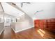 This large bonus room features hardwood floors, high ceilings and built in shelving at 3167 Bay View Dr, Jonesboro, GA 30236