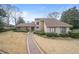 Charming home featuring a brick pathway and manicured hedges at 3167 Bay View Dr, Jonesboro, GA 30236